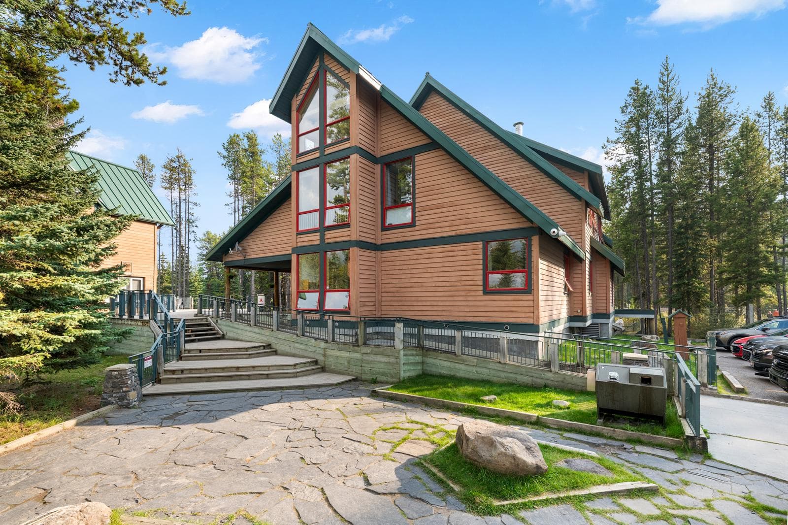 Wooden lodge exterior surrounded by forest